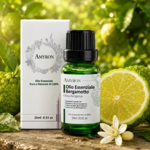 Olio essenziale di bergamotto puro AMYRON con confezione e frutti freschi di Citrus bergamia.