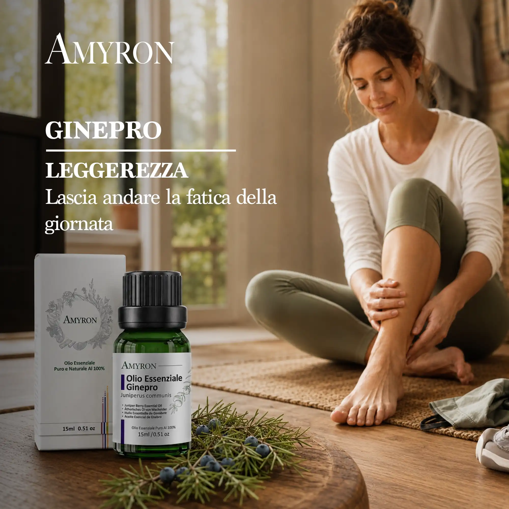 Donna seduta che si massaggia la gamba accanto all’olio essenziale di ginepro AMYRON