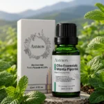 Olio essenziale di menta piperita AMYRON 100% puro e naturale in habitat botanico con foglie fresche di menta