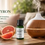 Diffusore per aromaterapia con olio essenziale di pompelmo AMYRON puro 100% in ambiente domestico.